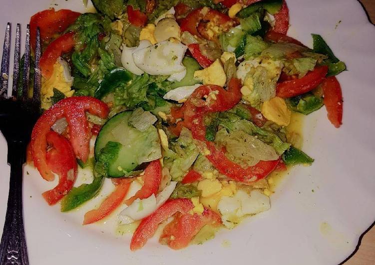 Vegetable salad served with boiled eggs