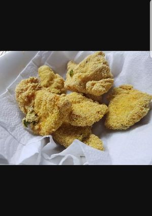 Una foto de Chicken fingers con Polenta