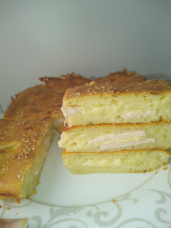 Una foto de Empanada pavo y queso
