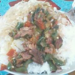 A picture of Beef stew with Rice.