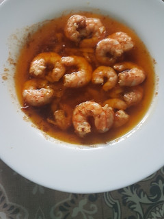 Una foto de Langostinos al pilpil