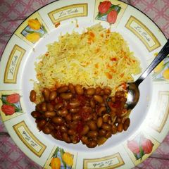 A picture of Carrot Rice and yellow beans.