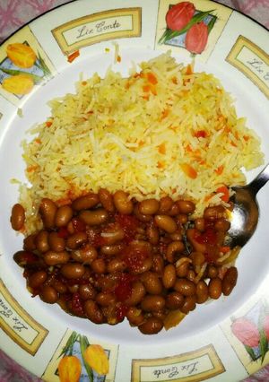 A picture of Carrot Rice and yellow beans.