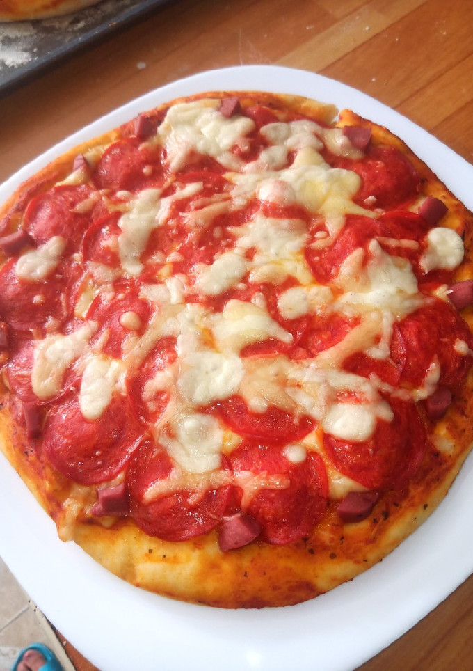 Una foto de Pizza a mi estilo