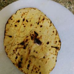 A picture of Whole wheat atta garlic naan.