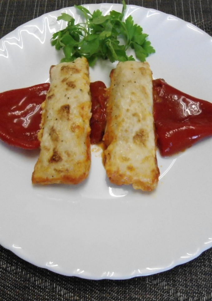 Una foto de Lomitos de merluza gratinados