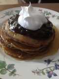 Cinnamon Clove Pancakes with Blueberry Sauce and Whipped Cream