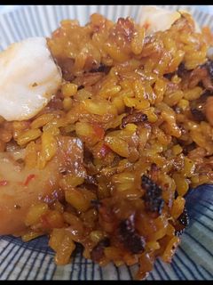 Una foto de Paella de rape y sepia