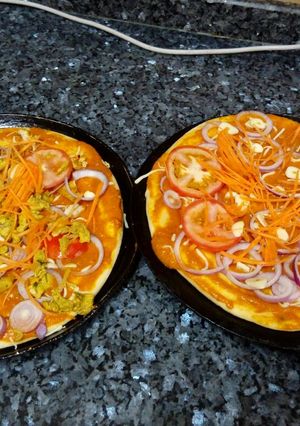 A picture of Periperi pizza 🍕 with cheese.
