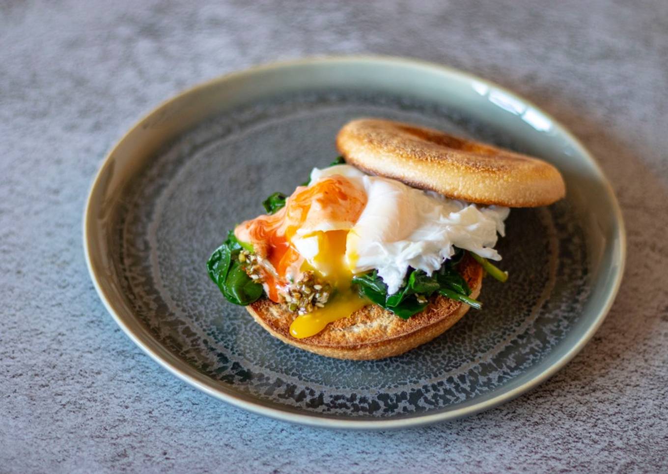 Poached egg on sriracha mayo, Toasted bagel and Korean spinach