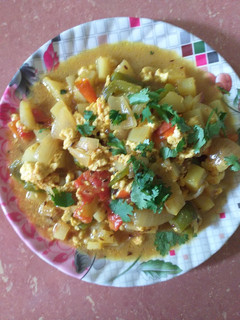 A picture of Aloo capsicum paneer curry.