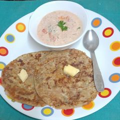 Dhaba Style Buttery Aloo Pyaz Paratha & Vegetable Raita With Special Masala A picture of Dhaba Style Buttery Aloo Pyaz Paratha & Vegetable Raita With Special Masala.