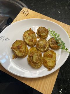 Una foto de Milhojas de patata al horno