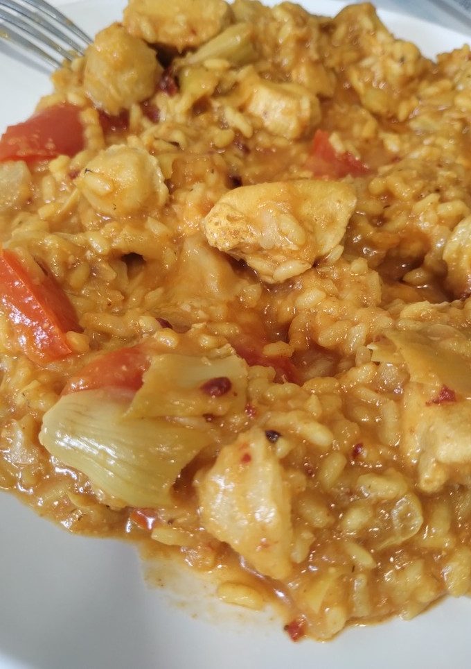 Una foto de Arroz y pollo
