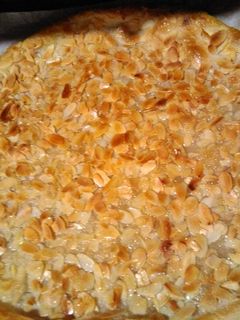 Una foto de Coca de anís y almendra