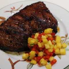 A picture of Asian-Spiced Flank Steak with Pineapple-Pepper Salsa.