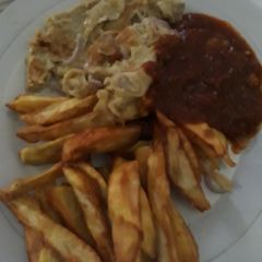 A picture of Fried sweet potatoes with fried egg.