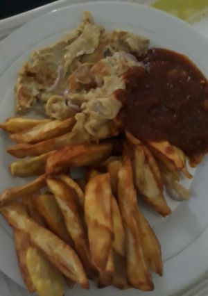 A picture of Fried sweet potatoes with fried egg.