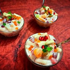 A picture of Fruit salad with coconut milk.