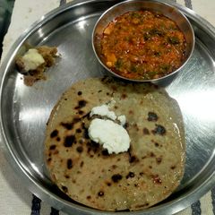 A picture of Traditional Thali with Bajri Bhakhri.