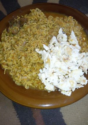 A picture of Noodles n scrambled eggs.
