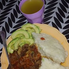 A picture of Ugali and meat.