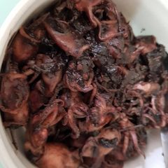 Squid cooked with ink and tamarind A picture of Squid cooked with ink and tamarind.