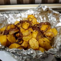 A picture of Baked Potatoes with sautee onion rings #Bakedsnackchallenge.
