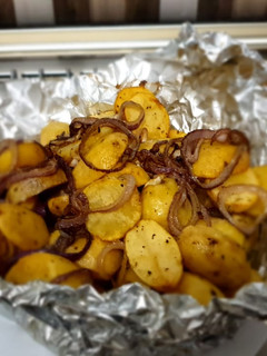A picture of Baked Potatoes with sautee onion rings #Bakedsnackchallenge.