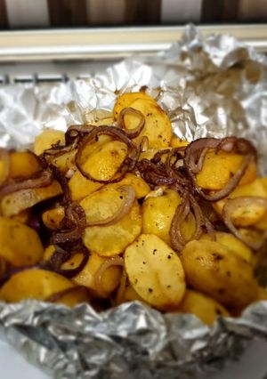 A picture of Baked Potatoes with sautee onion rings #Bakedsnackchallenge.