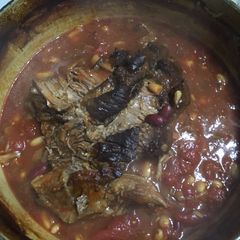 A picture of Slow roasted brisket with beans.