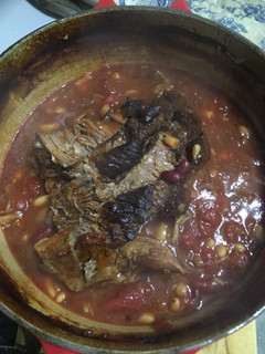 A picture of Slow roasted brisket with beans.