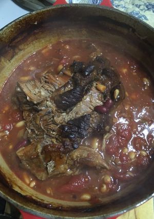 A picture of Slow roasted brisket with beans.