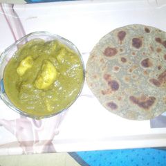A picture of Aloo palak veggie with bajra ki roti---.