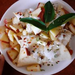 A picture of Mexican Bruttois with sour cream and apple salsa.