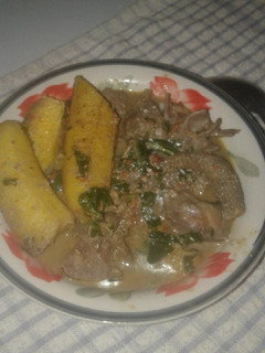 A picture of Semi Ripe Plantain in Assorted Goat meat pepper soup.