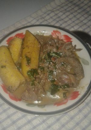 A picture of Semi Ripe Plantain in Assorted Goat meat pepper soup.