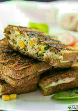 A picture of Grilled cheese and corn sandwich.