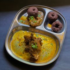 A picture of Koli (Chicken) Saaru (runny curry)- Karnataka style.