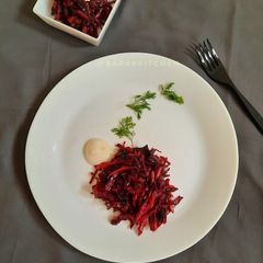 A picture of Wilted red velvet salad served with coconut cream.