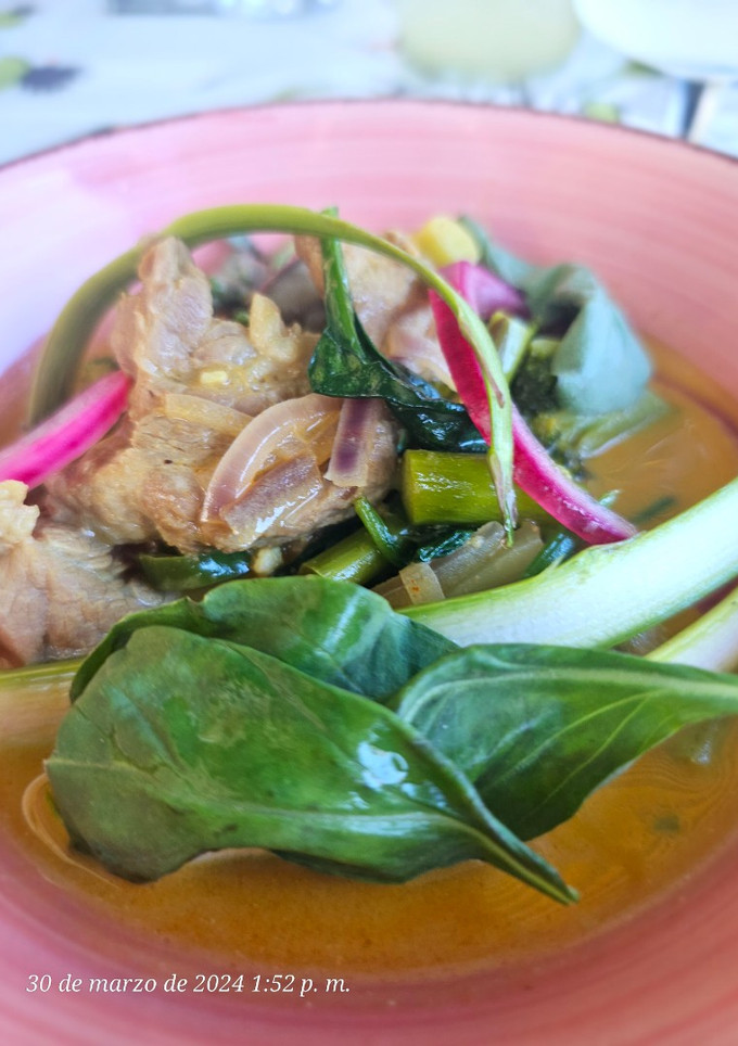 Una foto de Presa ibérica en salsa de curry rojo