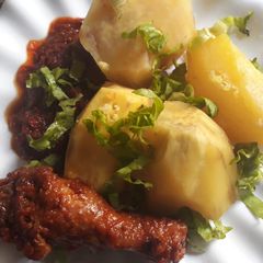 A picture of Boiled sweet potatoes and chicken stew.