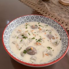 A picture of Shish Barak - Lebanese meat dumplings in cooked yogurt.