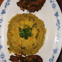 A picture of Fried rice with pepper chicken.