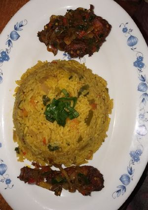 A picture of Fried rice with pepper chicken.
