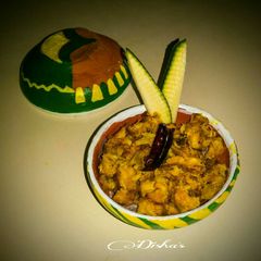 Aam-shol (Snake head murrel fish with green mango) A picture of Aam-shol (Snake head murrel fish with green mango).