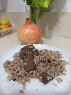 Una foto de Sepia al vino con arroz