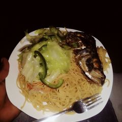 A picture of Spaghetti and fish.