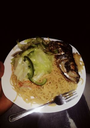 A picture of Spaghetti and fish.