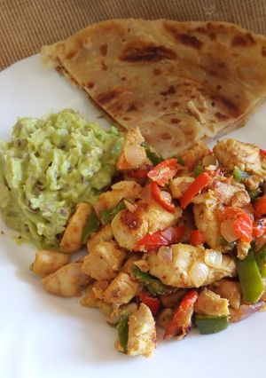 A picture of Stir fried chicken breast with guacamole.